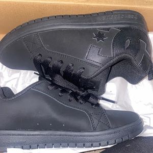 Black DC shoes, size 4.5 in kids/womens.
